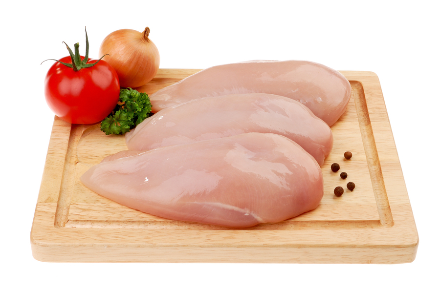 Fresh raw chicken breasts isolated on white background